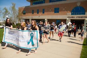 students walking for sexual violence awareness